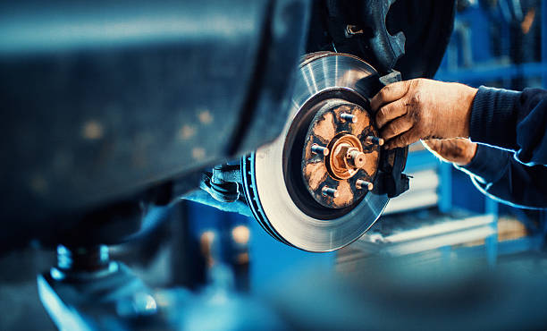 Mechanic working on a brake rotor
