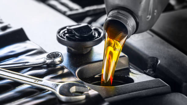 Pouring synthetic oil into an engine