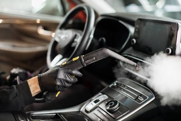 Steam cleaning a vehicle interior console